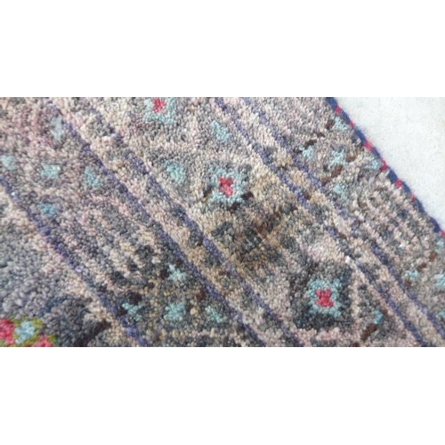 425 - A hand knotted Persian Baluchi rug - 2.25m x 1.23m