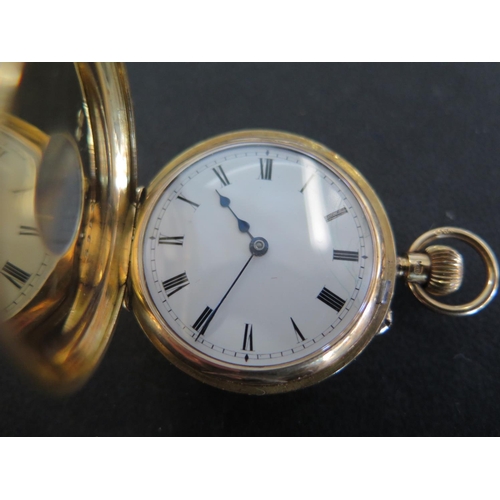 1066 - An 18ct yellow gold cased half Hunter ladies pocket watch with white enamel dial with Roman numerals... 