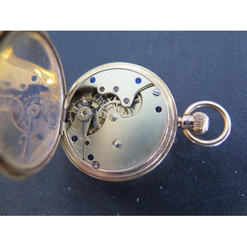 1071 - An 18ct yellow gold half Hunter ladies pocket watch, Roman numerals to white enamel dial subsidiary ... 