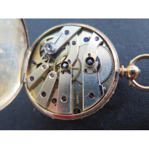 1072 - A 18ct yellow gold cased open faced pocket watch with white enamelled dial, Roman numerals and folia... 