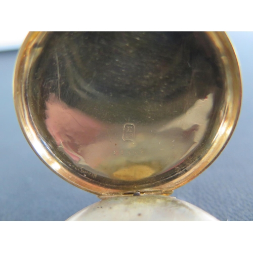 1072 - A 18ct yellow gold cased open faced pocket watch with white enamelled dial, Roman numerals and folia... 