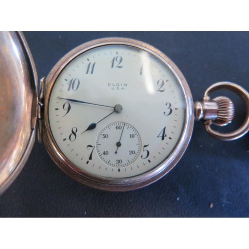 1081 - A brass cased Elgin full Hunter pocket watch with white enamel dial and Arabic numerals, subsidiary ... 