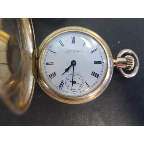 1081 - A brass cased Elgin full Hunter pocket watch with white enamel dial and Arabic numerals, subsidiary ... 