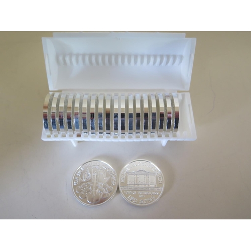 1107 - Twenty mint .999 silver 1oz Philharmoniker 2014 Austria 50 Euro coins held within a plastic tube, al... 