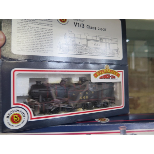 1154 - A collection of OO gauge railway including three boxed Bachmann locos and assorted rolling stock and... 