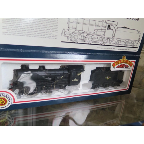 1154 - A collection of OO gauge railway including three boxed Bachmann locos and assorted rolling stock and... 