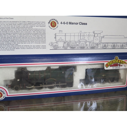 1154 - A collection of OO gauge railway including three boxed Bachmann locos and assorted rolling stock and... 