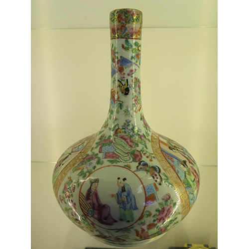 1213 - A Famille Rose bottle vase - Height 30cm - cracks running through body and top but no obvious repair... 