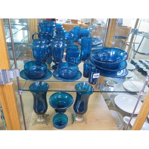 1229 - Twenty seven items of hand blown 20th century blue glassware - items include bowls, vases, plates et... 