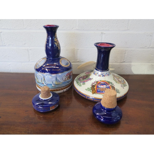 1240 - Four Wades Ceramic decanters containing Pussers Navy Rum all wax sealed with cork stoppers - two are... 