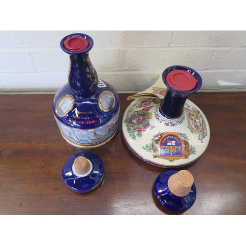 1240 - Four Wades Ceramic decanters containing Pussers Navy Rum all wax sealed with cork stoppers - two are... 