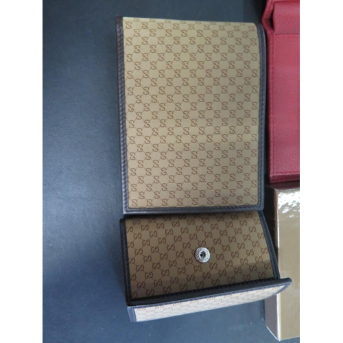 1292 - A Gucci wallet and key holder and a Rolex red leather wallet - all in good condition