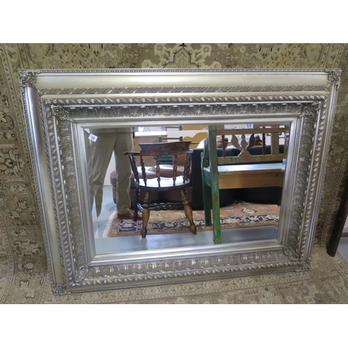 13 - A large modern mirror with bevelled edged glass can be hung either way - 135cm x 117cm