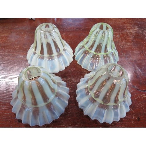 1368 - Four Vaseline glass light shades - Diameter 14cm x Height 11cm - some minor damage to inside top rim... 