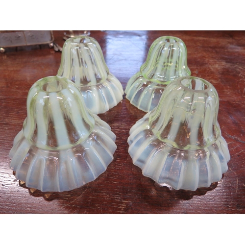 1368 - Four Vaseline glass light shades - Diameter 14cm x Height 11cm - some minor damage to inside top rim... 