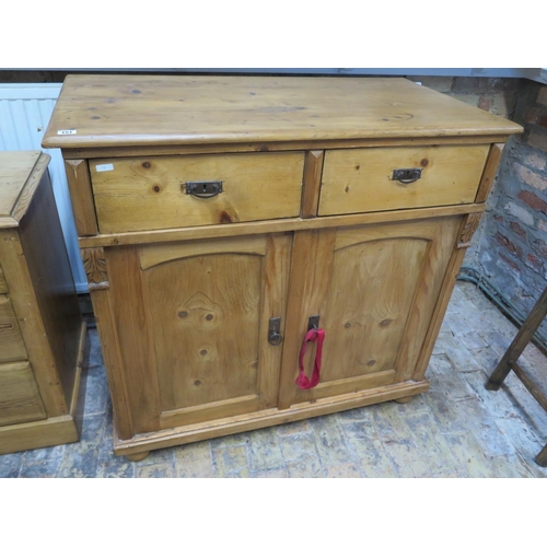 149 - A European stripped pine unit of 2 drawers over 2 cupboard doors, with lock and key - Width 105cm x ... 