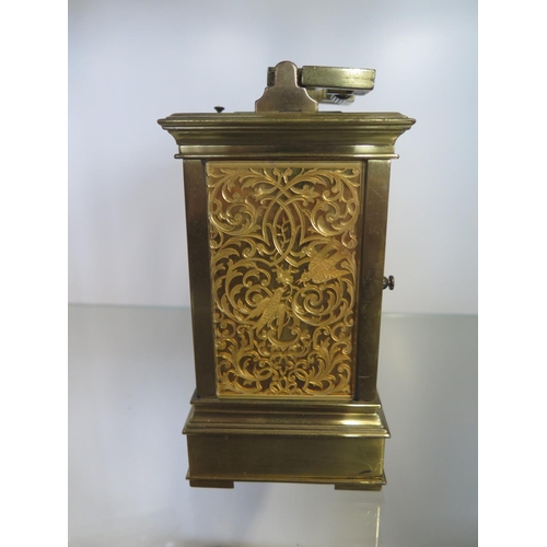 201 - A good quality brass carriage clock striking on a gong and bells with repeat with a gilt dial and fr... 