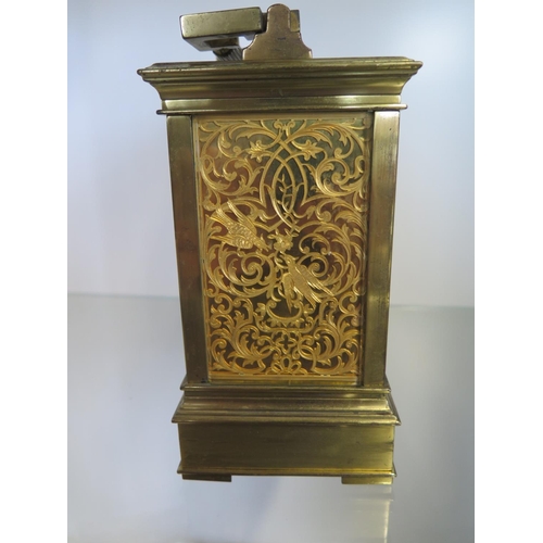 201 - A good quality brass carriage clock striking on a gong and bells with repeat with a gilt dial and fr... 