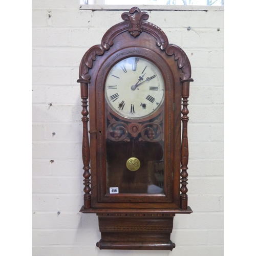 215 - An American inlaid striking wall clock, 92cm tall