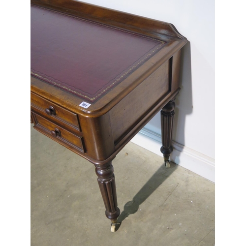 251 - A 19th century mahogany side table with a leather inset top over four drawers on turned reeded legs ... 