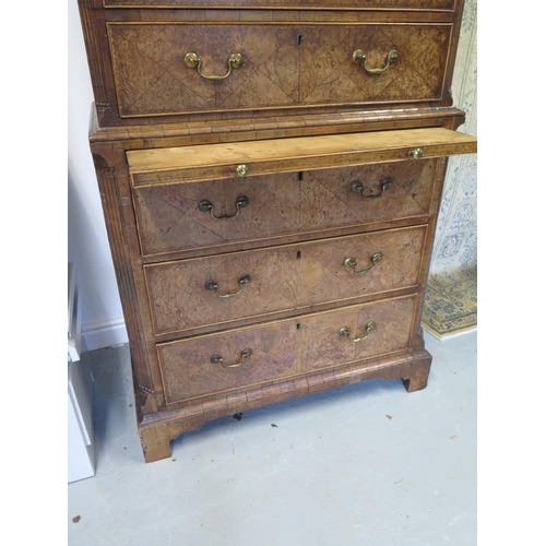 266 - An 18th century burr walnut chest on chest with a brushing slide and canted corners raised on bracke... 