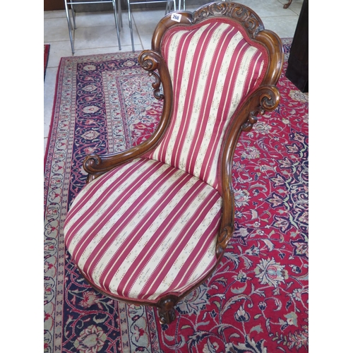 268 - A 19th century walnut upholstered nursing chair