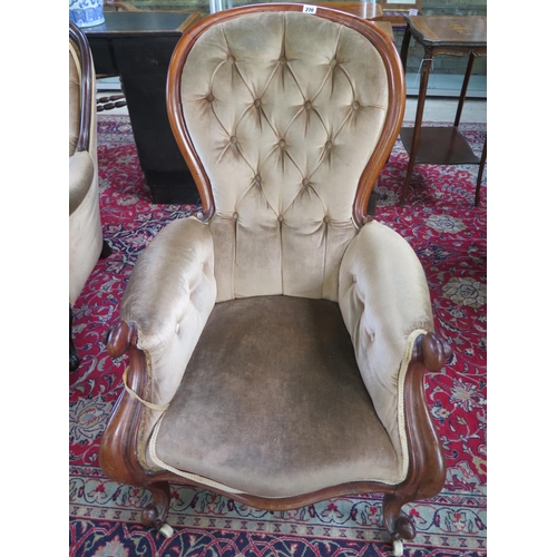 270 - A 19th century mahogany button back scroll armchair