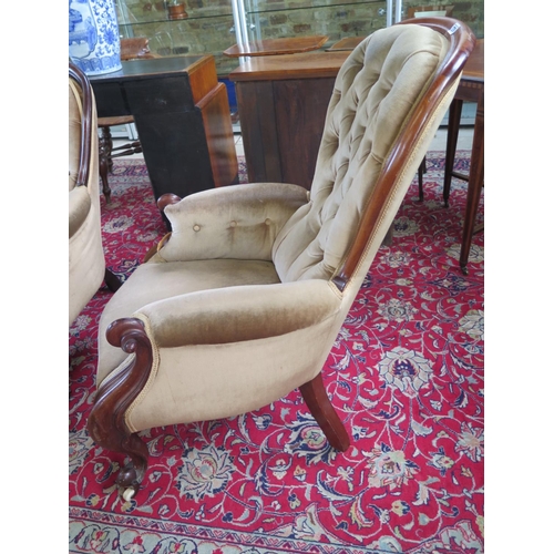 270 - A 19th century mahogany button back scroll armchair