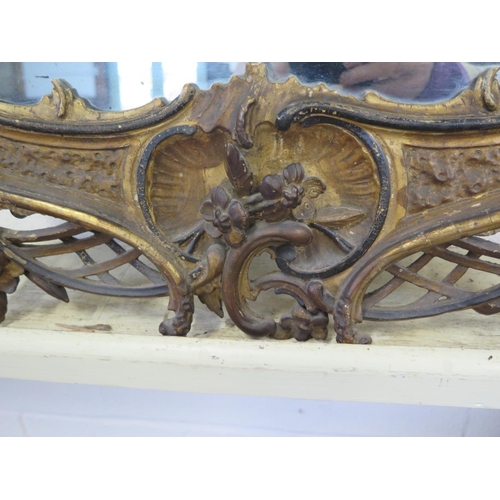 285 - An 18th century ornate gilt mirror - 127cm x 58cm