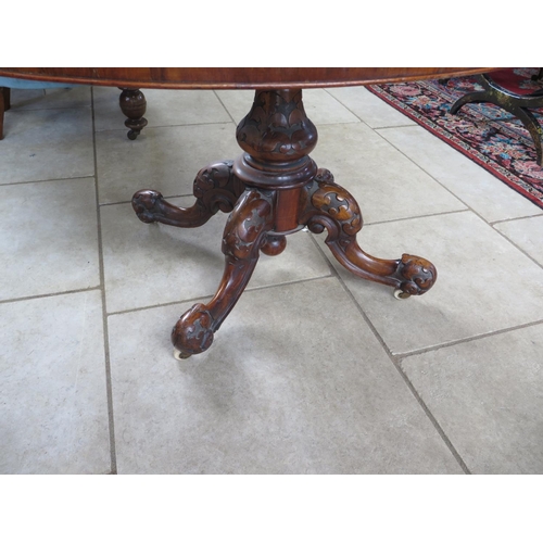 290 - A Victorian burr walnut oval breakfast table on a carved quatrefoil base - Height 71cm x 132cm x 95c... 