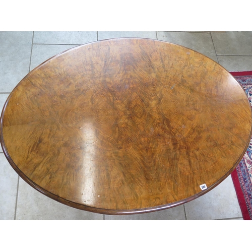 290 - A Victorian burr walnut oval breakfast table on a carved quatrefoil base - Height 71cm x 132cm x 95c... 