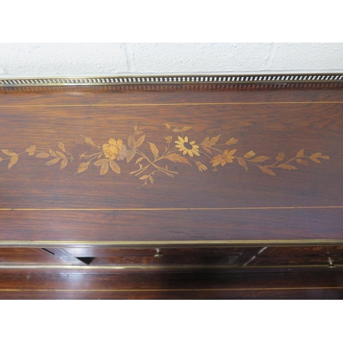 296 - A 19th century inlaid rosewood bonheur de jour with a brass gallery on five drawer upstand with a fo... 