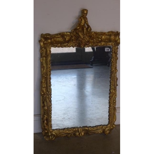 301 - A Victorian carved wood gilded frame Italian Viennese wall mirror surmounted by a cherub - 93cm x 54... 