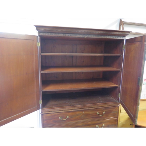 303 - A 19th century mahogany linen press with a shelved interior above three long drawers - Height 185cm ... 