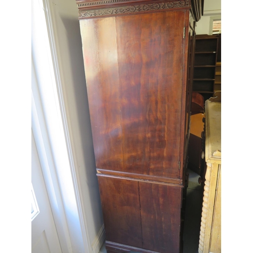 303 - A 19th century mahogany linen press with a shelved interior above three long drawers - Height 185cm ... 