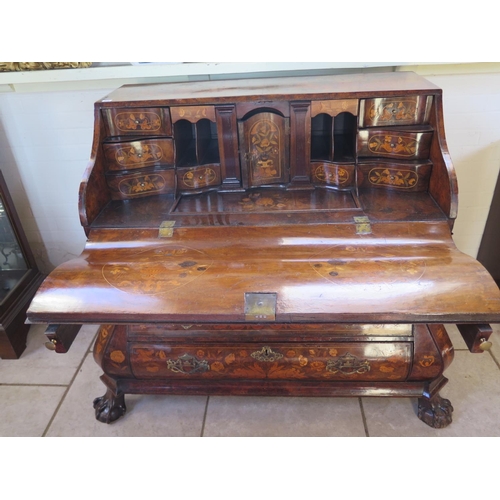 315 - An 18th century Dutch marquetry inlaid walnut and mahogany two piece bombe front bureau, the fall fl... 