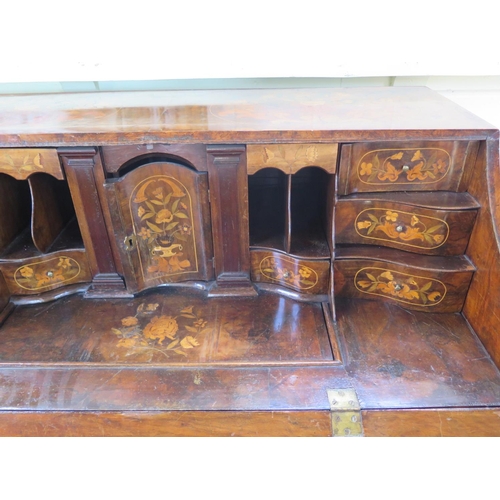 315 - An 18th century Dutch marquetry inlaid walnut and mahogany two piece bombe front bureau, the fall fl... 