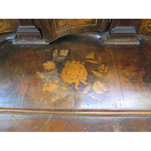 315 - An 18th century Dutch marquetry inlaid walnut and mahogany two piece bombe front bureau, the fall fl... 