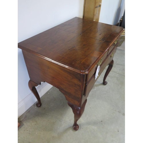 325 - A Georgian walnut three drawer lowboy on cabirole legs and pad feet in restored condition - Height 7... 