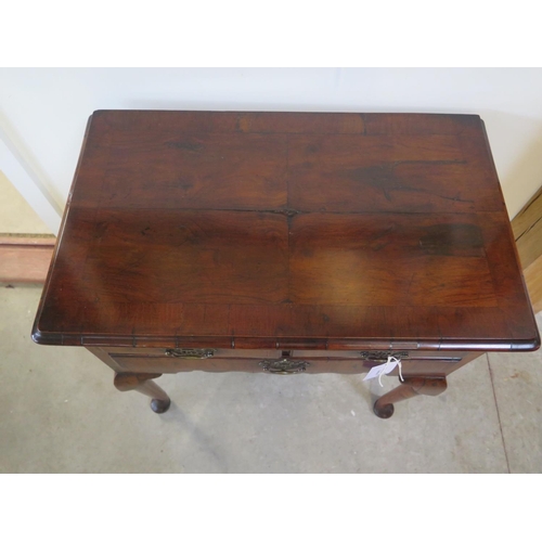 331 - An 18th century walnut three drawer lowboy on shaped legs and pad feet - Height 71cm x 74cm x 44cm  ... 