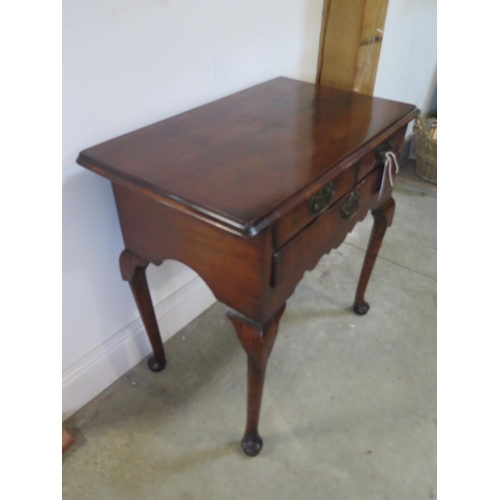 331 - An 18th century walnut three drawer lowboy on shaped legs and pad feet - Height 71cm x 74cm x 44cm  ... 