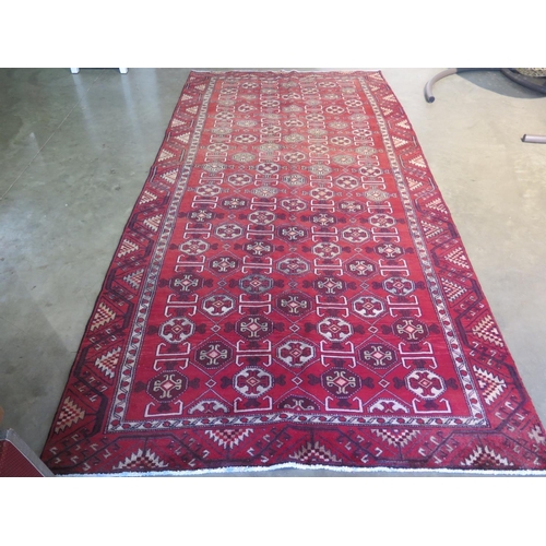 421 - A hand knotted woolen Turkman rug - 2.94m x 1.48m - fade to one end