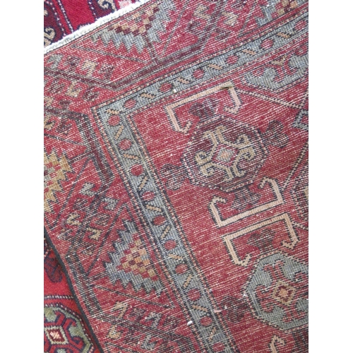 421 - A hand knotted woolen Turkman rug - 2.94m x 1.48m - fade to one end