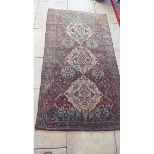 425 - A hand knotted Persian Baluchi rug - 2.25m x 1.23m