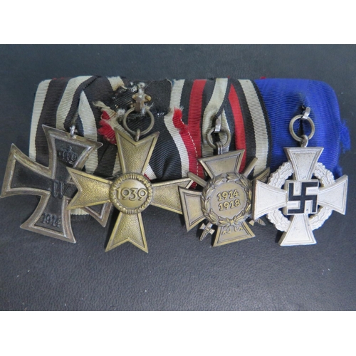 503 - A group of four German Medals including a WWI Iron Cross 2nd Class, a 1914-18 German Honour Cross, a... 