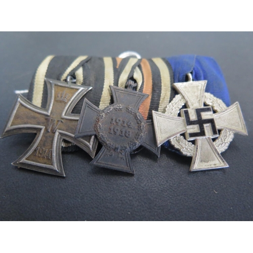 504 - A group of three German Medals including a WWI Iron Cross 2nd Class, a 1914-18 German Honour Medal a... 