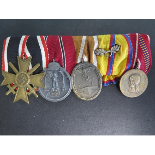 505 - A group of four German Medals including a 1939 Nazi Iron Cross Medal, a WWII East Medal 1941-42 Wehr... 