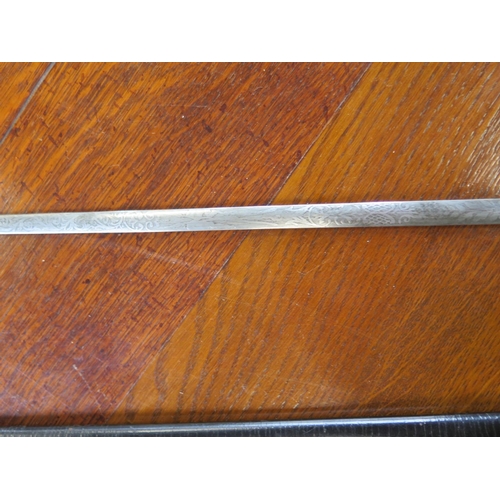 533 - A ceremonial dress sword and scabbard - Total length 98cm