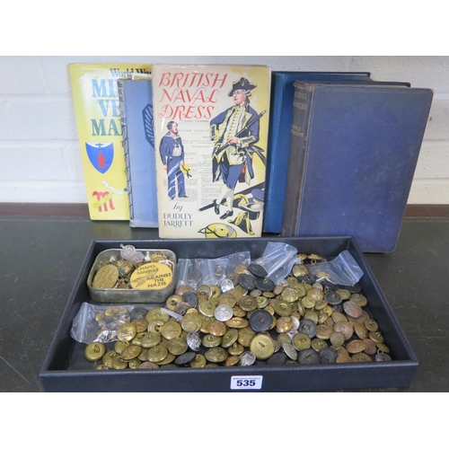 535 - A collection of military badges and buttons together with a 1st edition copy of British Naval Dress ... 