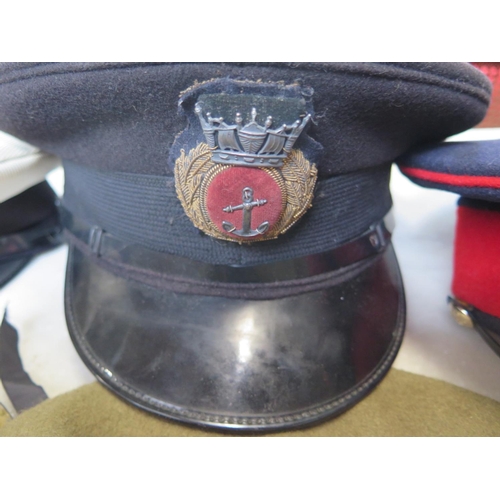 537 - A tin helmet, sash, two Merchant Navy peaked caps, household Cavalry peaked cap and Spanish beret